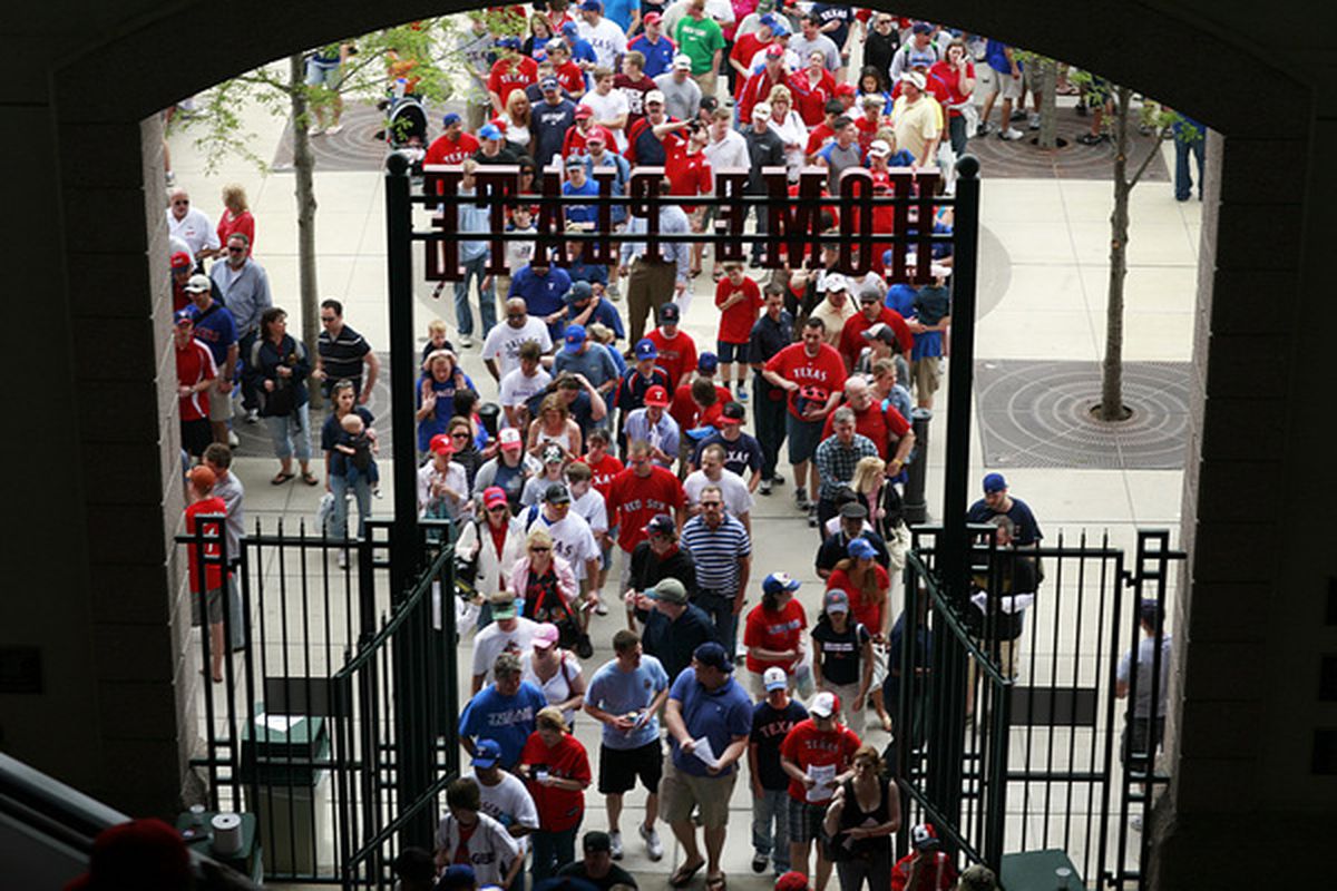 ARLINGTON, TX - APRIL 05:  Baseball fans file into Rangers Ballpark before the Texas Rangers take on the Toronto Blue Jays on Opening Day at Rangers Ballpark on April 5, 2010 in Arlington, Texas. (Photo by Tom Pennington/Getty Images)