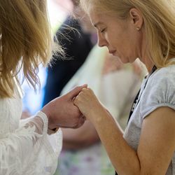 Dawn Seamons, a registered nurse at St. Mark's Hospital in Millcreek, receives a blessing from chaplain Heidi Cuevas, of The Church of Jesus Christ of Latter-day Saints, during the 18th annual Blessing of the Hands at the hospital on Monday, May 13, 2019. The annual ceremony, featuring spiritual leaders from different denominations, recognizes hospital employees for all that they do to promote healing and provide comfort for patients throughout the year.