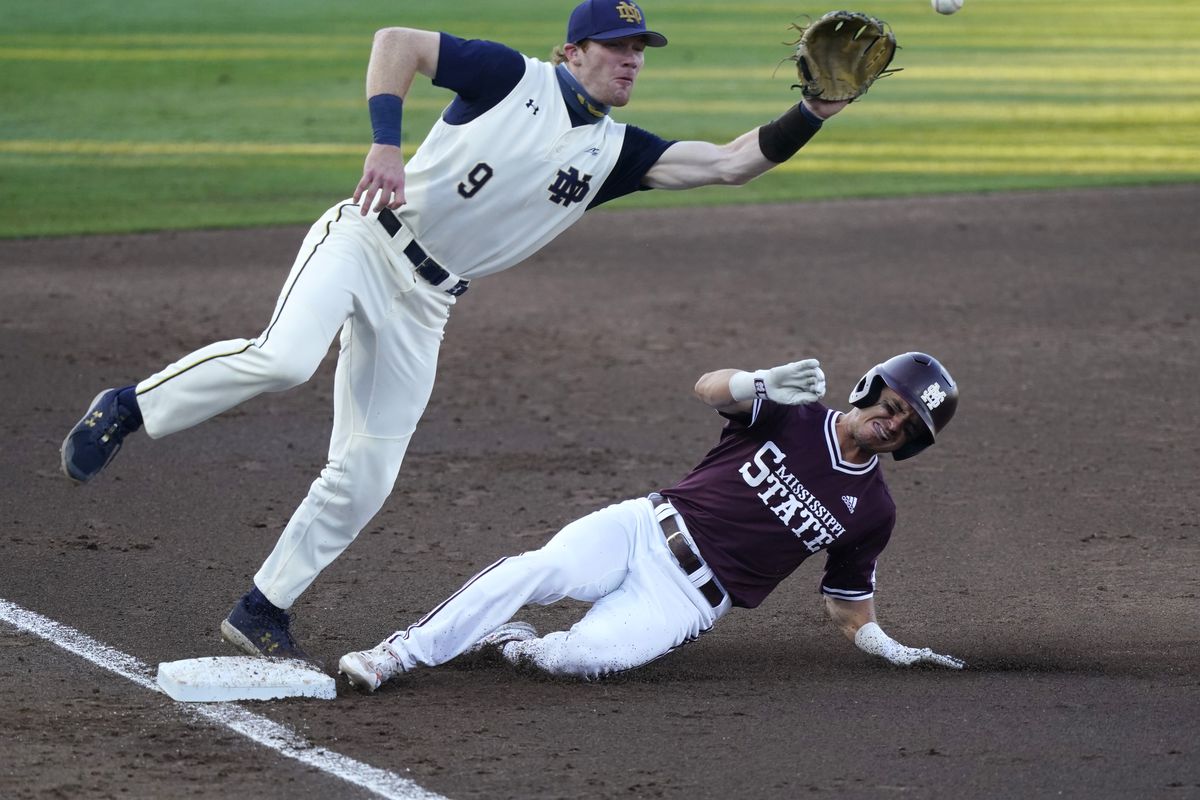 Notre Dame infielder Jack Brannigan moves toward the ball as Mississippi State’s Scott Dubrule steals third base.
