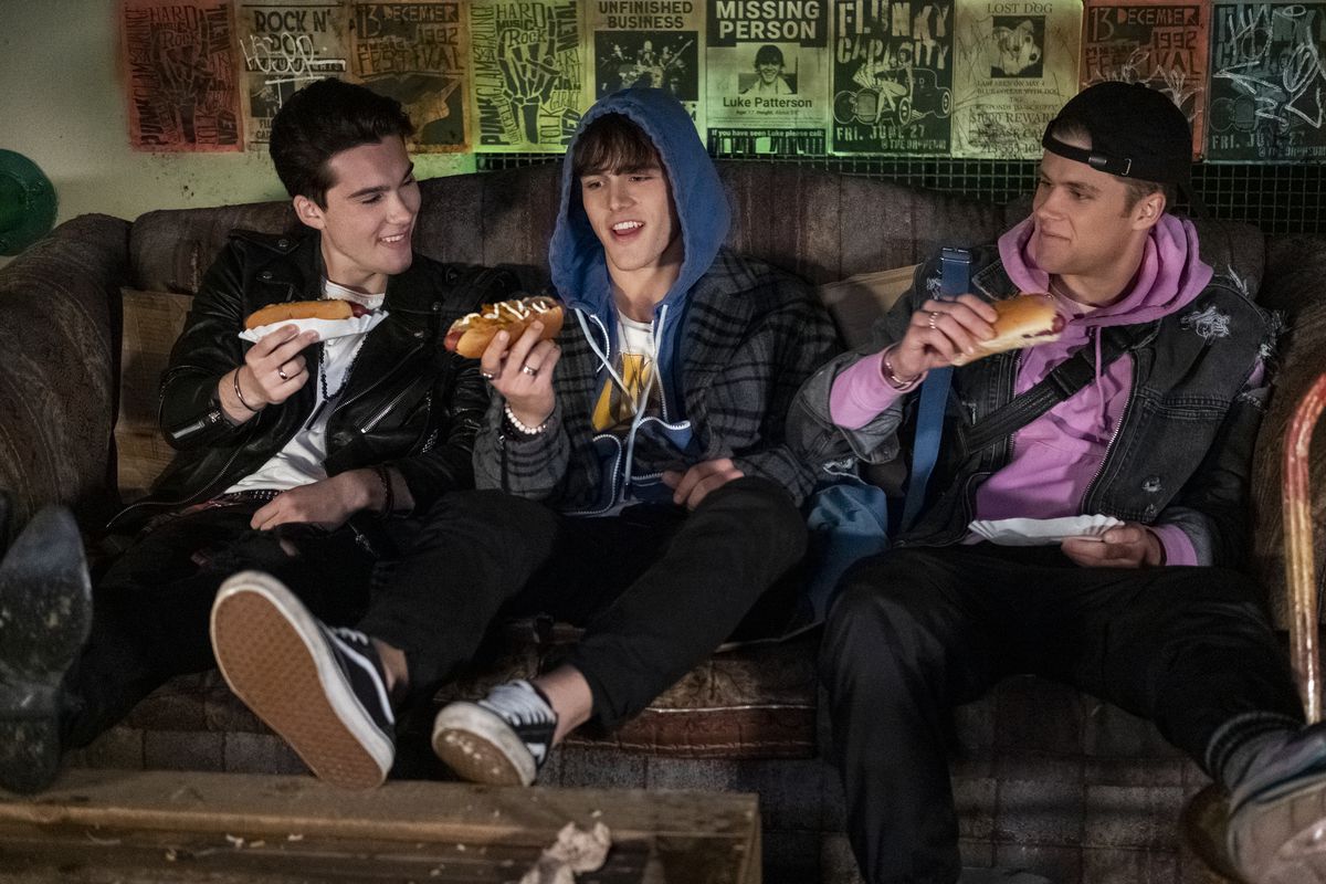 the boy band about to chow down on some hot dogs