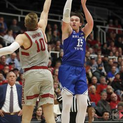 BYU forward Payton Dastrup (15) shoots over Stanford forward Michael Humphrey (10) during the second half of an NCAA college basketball game in the first round of the NIT, Wednesday, March 14, 2018, in Stanford, Calif. (AP Photo/Tony Avelar)