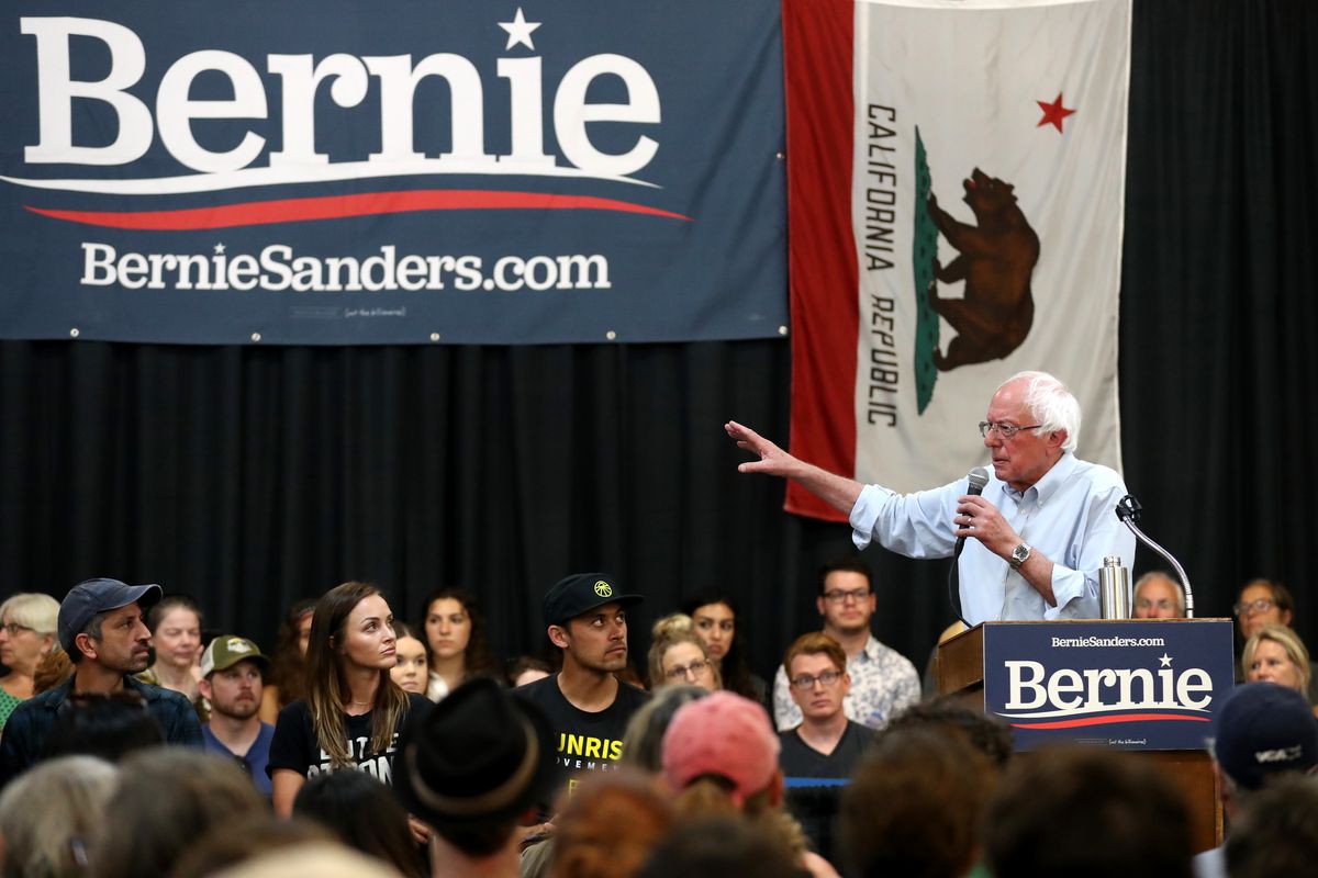 Bernie Sanders speaks to a crowd at a rally.