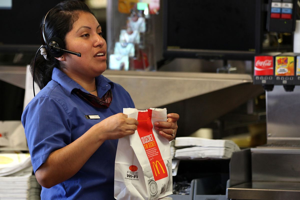 A McDonald’s employee prepares an order