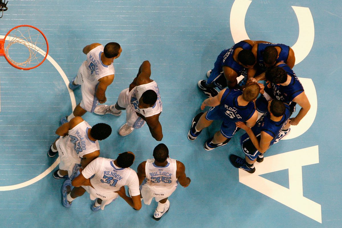 CHAPEL HILL, NC - FEBRUARY 08:  The North Carolina Tar Heels and the Duke Blue Devils huddle up before a free throw during their game at the Dean Smith Center on February 8, 2012 in Chapel Hill, North Carolina.  (Photo by Streeter Lecka/Getty Images)
