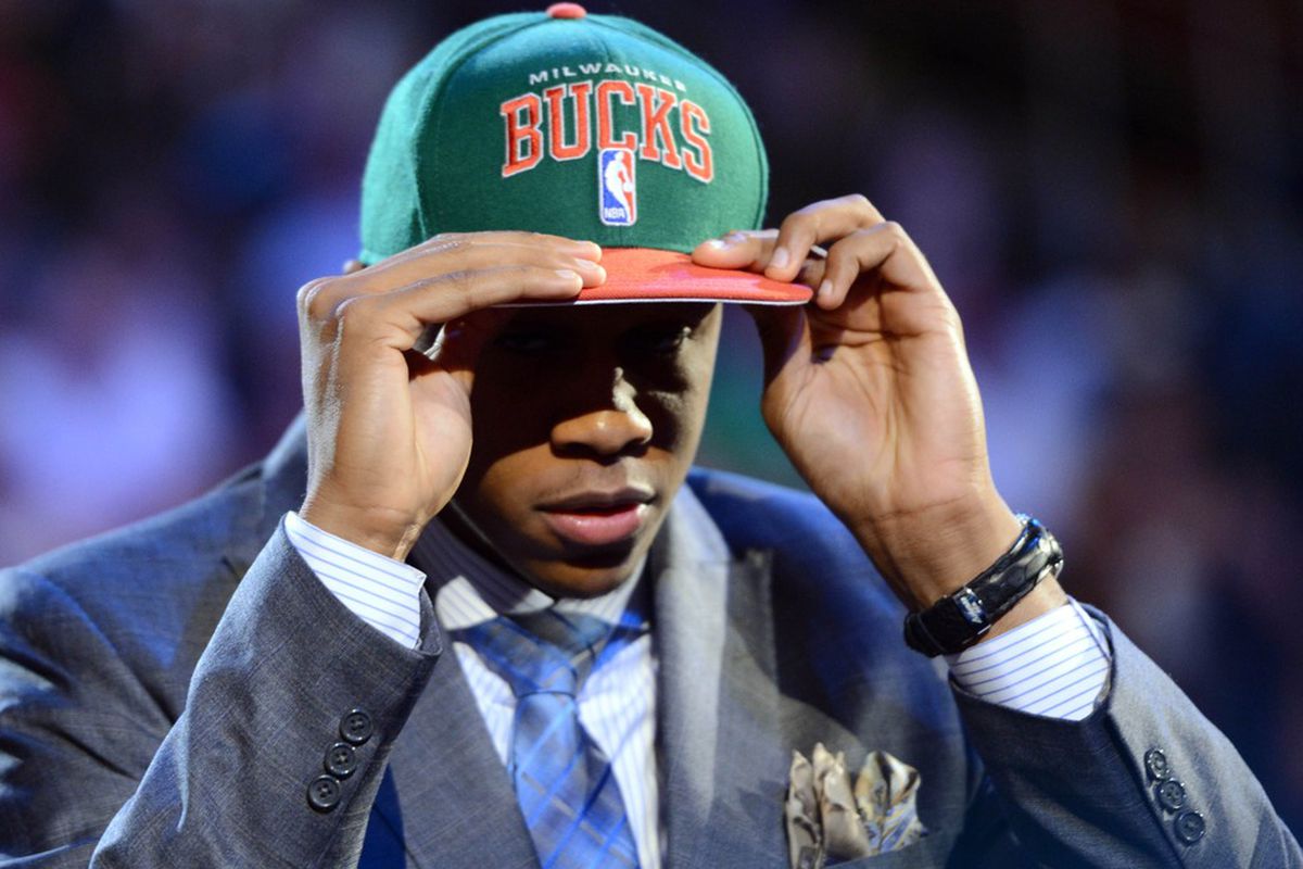 June 28, 2012; Newark, NJ, USA; John Henson (North Carolina) puts on a cap after being introduced as the number fourteen overall pick to the Milwaukee Bucks during the 2012 NBA Draft at the Prudential Center.  Mandatory Credit: Jerry Lai-US PRESSWIRE