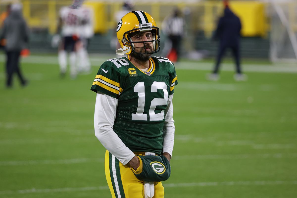 aron Rodgers #12 of the Green Bay Packers warms up before the game against the Chicago Bears at Lambeau Field on November 29, 2020 in Green Bay, Wisconsin.