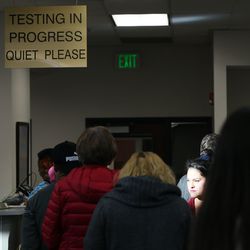 People wait at the driver license division in West Valley City on Wednesday, Jan. 30, 2019.