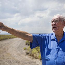 Bill Gardner points out different areas of the Topaz Internment Camp near what used to be the main gate on Friday, July 7, 2017. Gardner was 16 years old when he helped construct the camp, located  16 miles from Delta, for two months before returning to high school. His father also worked at the camp while it was open.