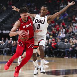 Utah Utes forward Timmy Allen (1) gets fouled by Oregon State Beavers guard Gianni Hunt (0) during the first round of the Pac-12 men’s basketball tournament at T-Mobile Arena in Las Vegas on Wednesday, March 11, 2020.