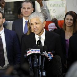 Daniel Petrocelli, lead attorney for President-elect Donald Trump, speaks after a hearing involving a lawsuit against the now-defunct Trump University Friday, Nov. 18, 2016, in San Diego. Trump agreed Friday to pay $25 million to settle several lawsuits alleging that his former business venture for real estate investors defrauded students who paid up to $35,000 to enroll in Trump University programs. 