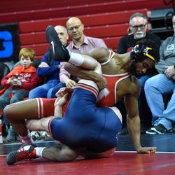 Nebraska’s Chad Red Jr. (top) puts Illinois’ Dylan Duncan on his back on Feb. 13, 2022 at the Bob Devaney Sports Center.