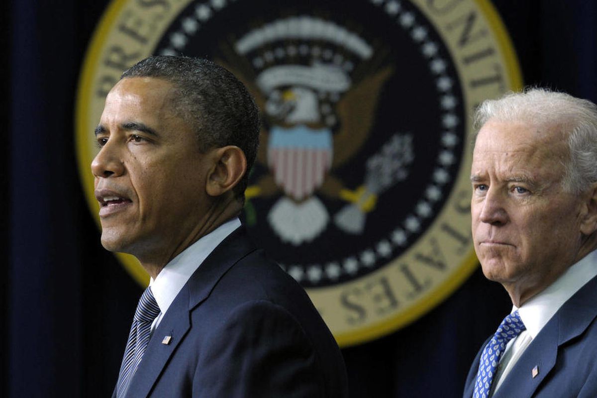 In this Jan. 16, 2013 file photo, President Barack Obama, accompanied by Vice President  Joe Biden, talks about proposals to reduce gun violence, in the South Court Auditorium at the White House in Washington. President Barack Obama is bringing 11 relativ