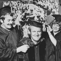 BYU head football coach LaVell Edwards with daughter Ann and her husband Ken Cannon as he receives a doctoral degree at BYU Aug. 14, 1978.