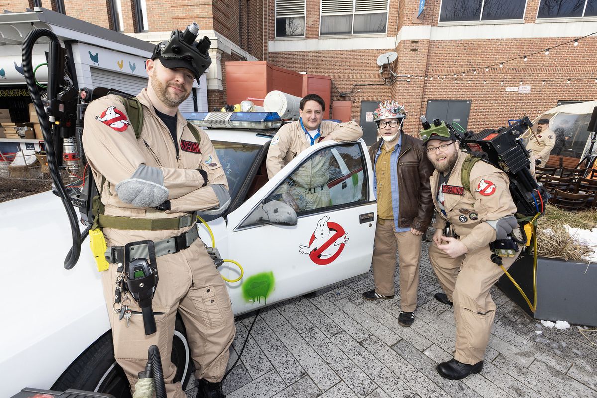 A group of folks dressed up like folks from Ghostbusters.