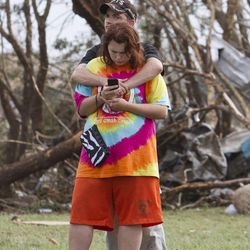 A couple after a tornado moves through Moore, Okla. on Monday, May 20, 2013.