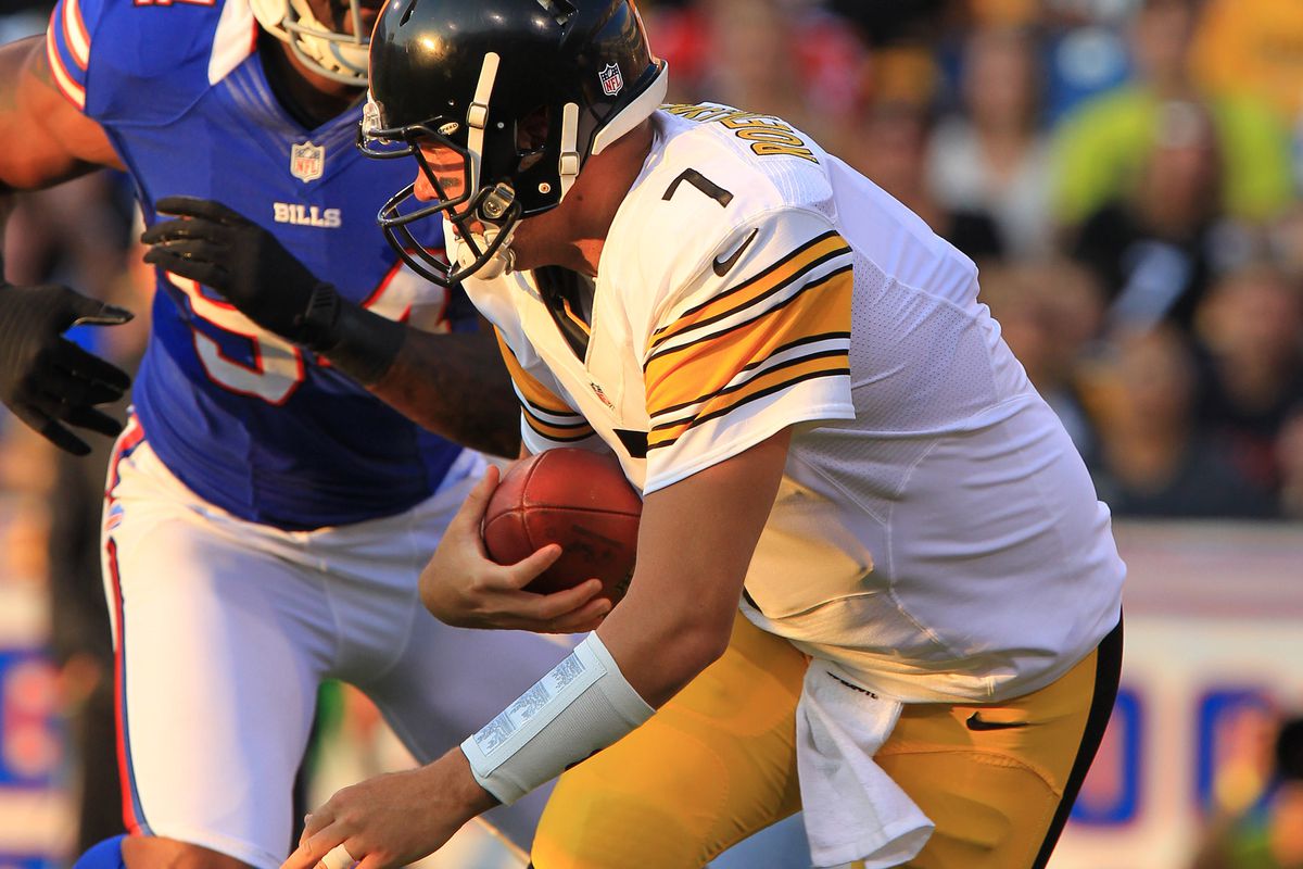 Aug 25, 2012; Orchard Park, NY, USA; Pittsburgh Steelers quarterback Ben Roethlisberger (7) is chased by Buffalo Bills defensive end Mario Williams (94) during the first quarter at Ralph Wilson Stadium. Mandatory Credit: Kevin Hoffman-US PRESSWIRE