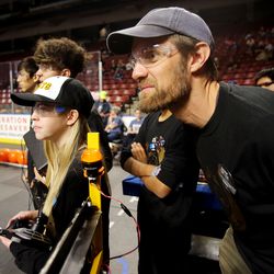 Rachel Arlen and Chris Hirschi watch as the Cottonwood High School robot is put through the course as they compete in the First Robotics Competition Utah Regional event at the Maverik Center in West Valley City, Utah, on Friday, March 29, 2019.