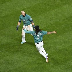SEATTLE, WASHINGTON - AUGUST 26: Mitch Haniger #17 of the Seattle Mariners celebrates with J.P. Crawford #3 after his walk-off single to end the game against the Cleveland Guardians at T-Mobile Park on August 26, 2022 in Seattle, Washington. The Seattle Mariners won 3-2 in eleven innings.