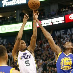 Utah Jazz guard Rodney Hood (5) shoots in the first half of an NBA regular season game against the Golden State Warriors at the Vivint Arena in Salt Lake City, Wednesday, March 30, 2016.