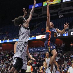 Connecticut Sun's Morgan Tuck (33) goes in for a layup.