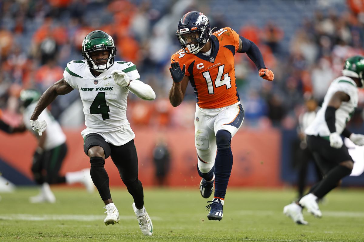 Courtland Sutton #14 of the Denver Broncos runs a route against D.J. Reed #4 of the New York Jets during an NFL football game between the Denver Broncos and the New York Jets at Empower Field At Mile High on October 23, 2022 in Denver, Colorado.