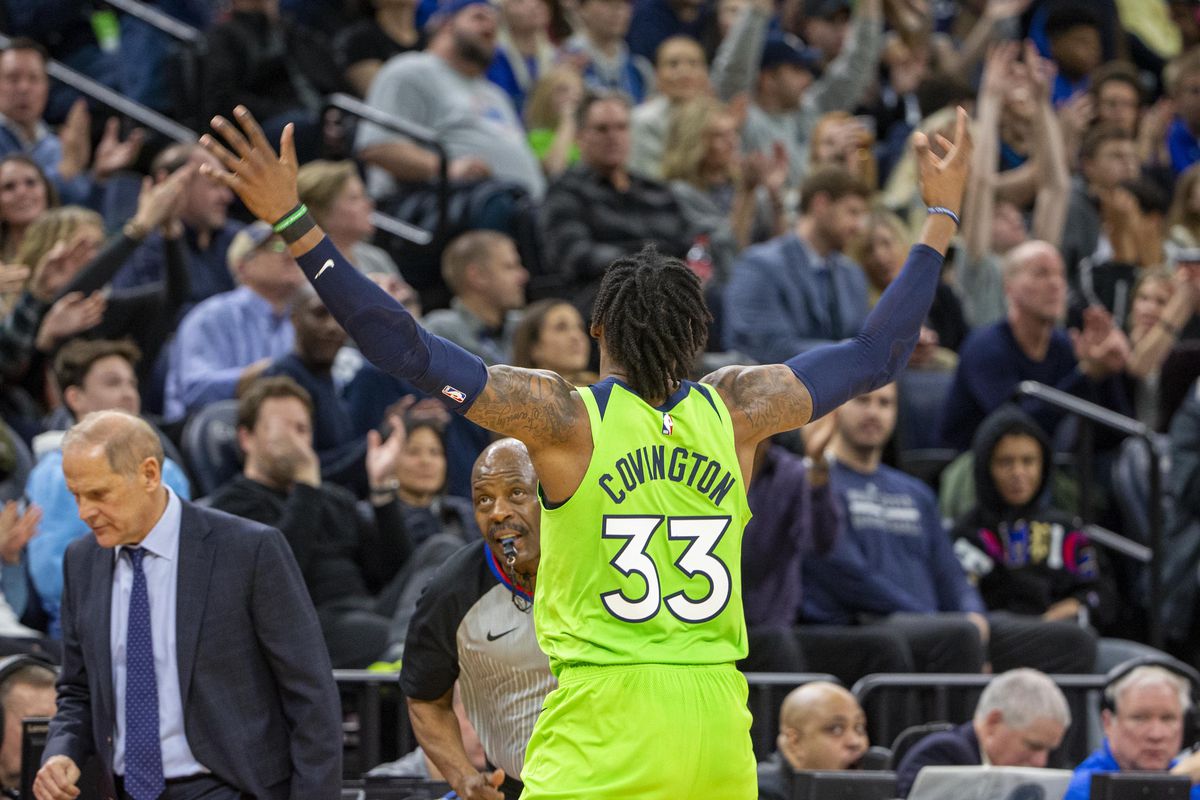 Minnesota Timberwolves forward Robert Covington raises his arms to pump up the crowd after making a three point shot in the second half against the Cleveland Cavaliers at Target Center.&nbsp;