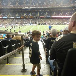 My son walking to our seats