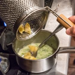Cooked agnolotti are added to the beurre fondue.