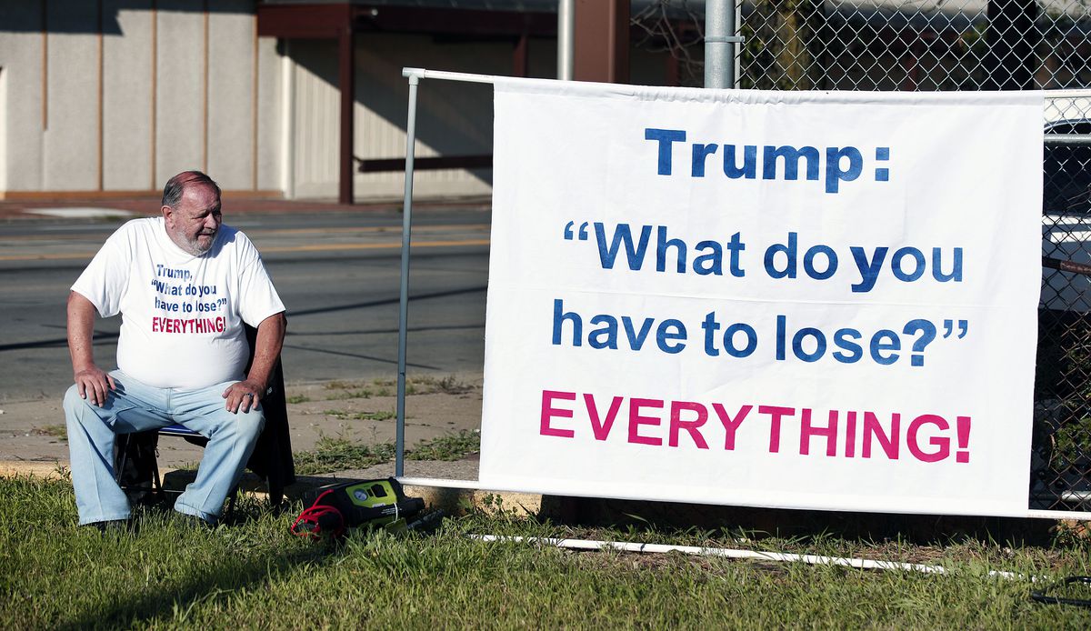 A protester outside Donald Trump's appearance at a Detroit church.