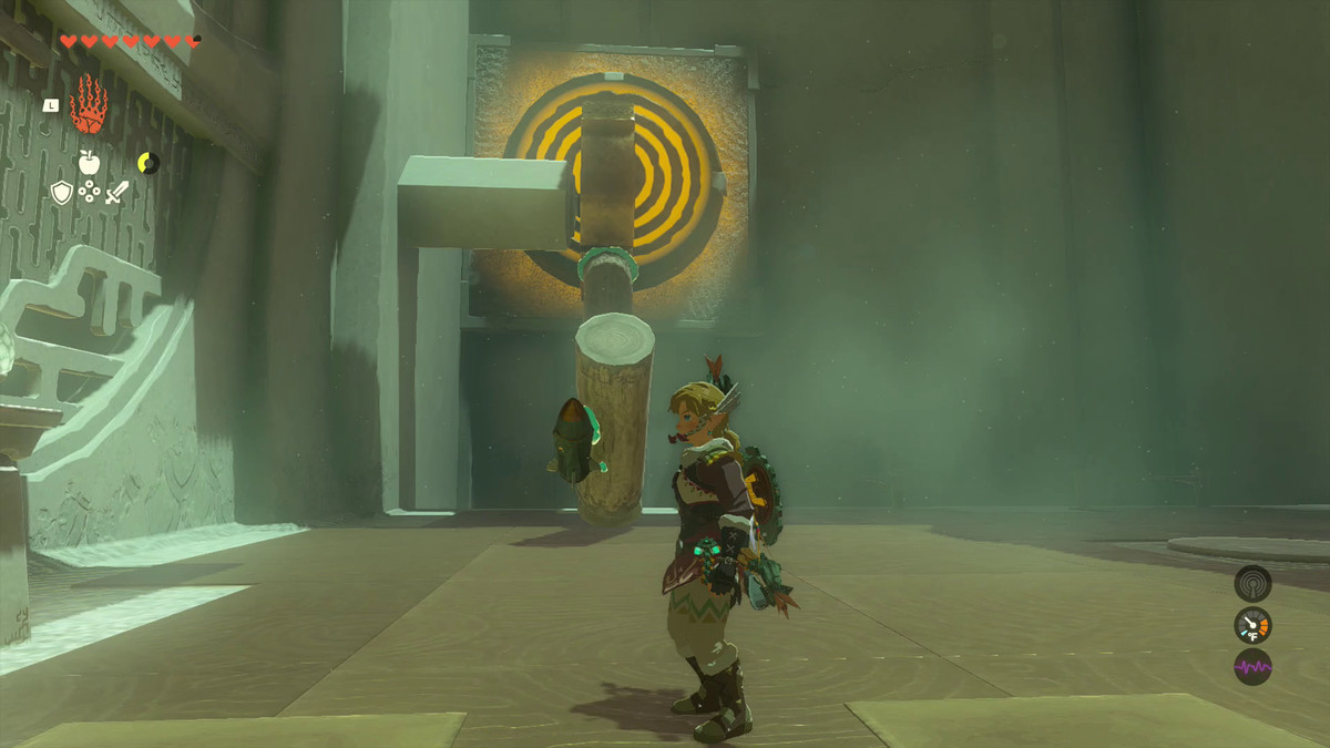 Link stands back from his handiwork: Two wooden logs with a rocket on the end, affixed to a gear and poised to hit a yellow target in Oshozan-u Shrine