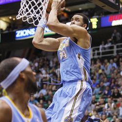 Denver's Javale McGee goes high for a monster dunk as the Utah Jazz and Denver Nuggets play Wednesday, April 3, 2013 in Salt Lake City at EnergySolutions Arena. Denver beat the Jazz 113-96.