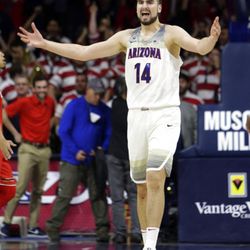Arizona center Dusan Ristic (14) reacts after defeating Utah in an NCAA college basketball game, Saturday, Jan. 27, 2018, in Tucson, Ariz. (AP Photo/Rick Scuteri)
