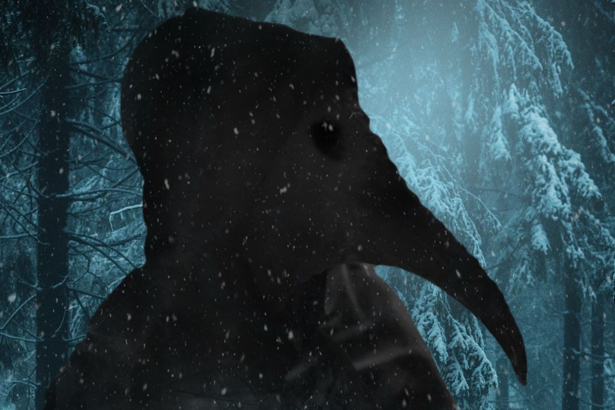 A plague-doctor figure in a long-beaked bird mask is silhouetted against a snowy forest in a poster detail from 2022’s The Harbinger
