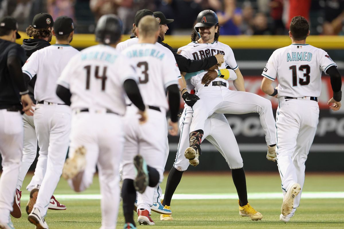 Corbin Carroll of the Arizona Diamondbacks celebrates with teammates after a walk-off two RBI single during the ninth inning of the MLB game against the Colorado Rockies at Chase Field on June 01, 2023 in Phoenix, Arizona. The Diamondbacks defeated the Rockies 5-4.