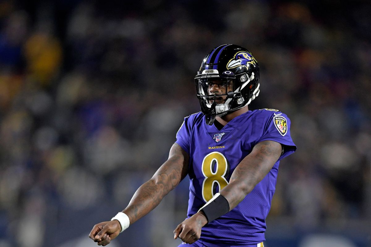 Baltimore Ravens quarterback Lamar Jackson celebrates after Baltimore Ravens running back Mark Ingram scored a touchdown against the Los Angeles Rams during the second half at Los Angeles Memorial Coliseum.