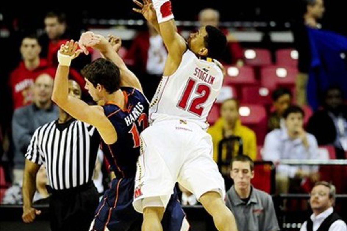 March 4, 2012; College Park, MD, USA; Maryland Terrapins guard Terrell Stoglin (right) is fouled on a three pointer by Virginia Cavaliers guard Joe Harris (left) at Comcast Center. Mandatory Credit: Evan Habeeb-US PRESSWIRE