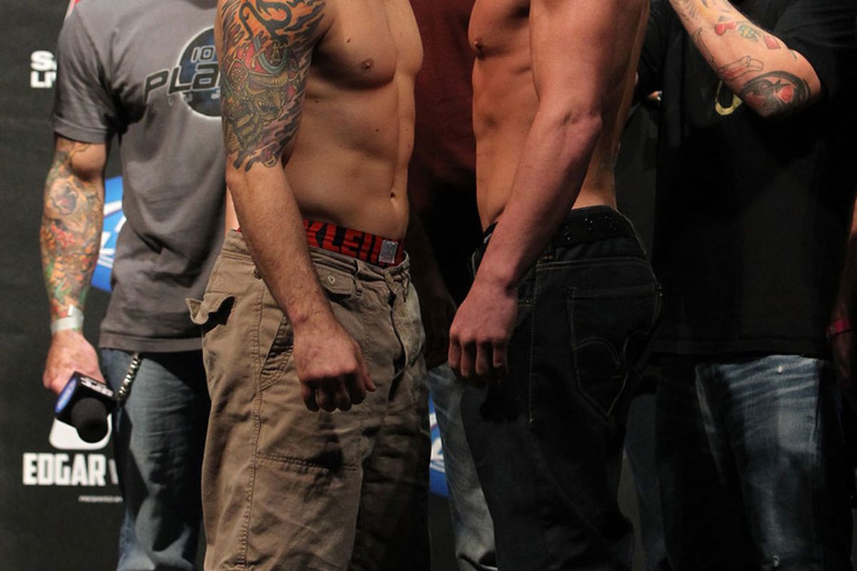 Frankie Edgar (<strong>154.5</strong>) vs. Gray Maynard (<strong>155</strong>) -- Photo via <a href="http://video.ufc.tv/136/images/136weighins/56_136Weighins.jpg">UFC.com</a>