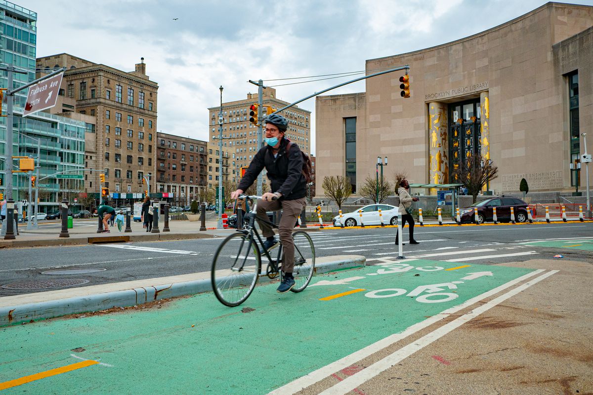 A cyclist uses the greenway at Grand Army Plaza, in Brooklyn, March 31, 2021.