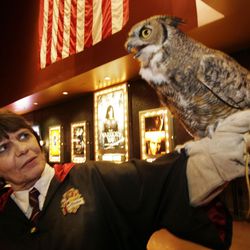 Judi Jenson holds her pet owl Earl while waiting for the new Harry Potter movie at the Gateway Multiplex in Salt Lake City, Utah, Thursday, Nov. 18, 2010.