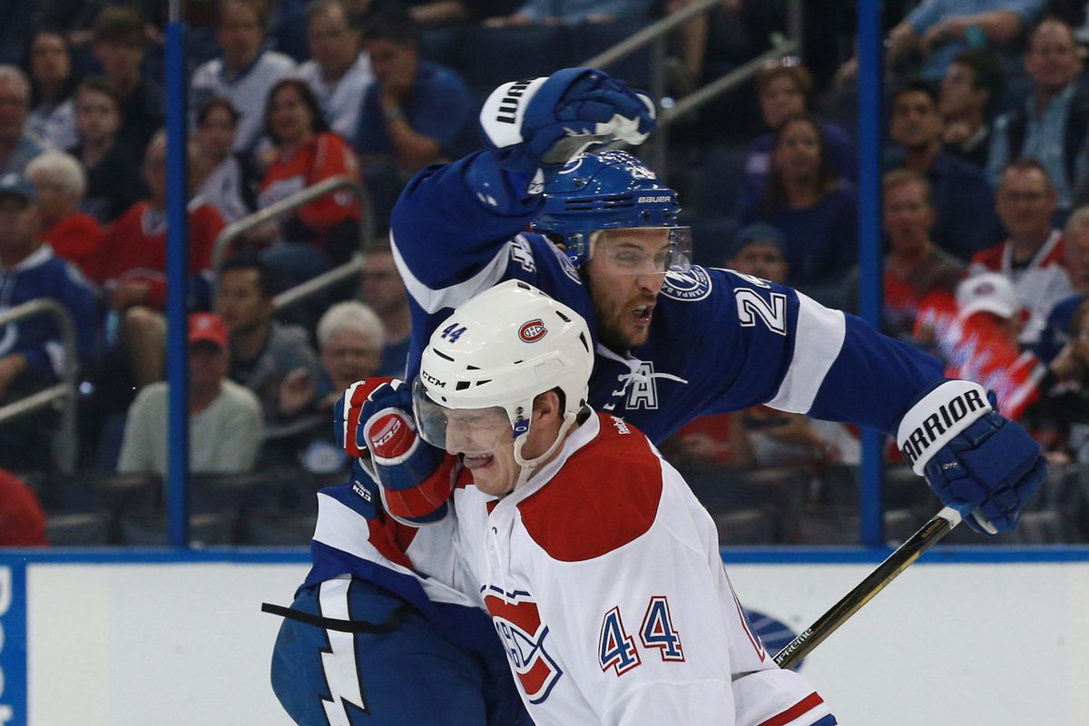 Ryan Callahan tries to avoid contact with Darren Dietz during the Lightning's 3-0 loss to the Montreal Canadiens Thursday night in Tampa.