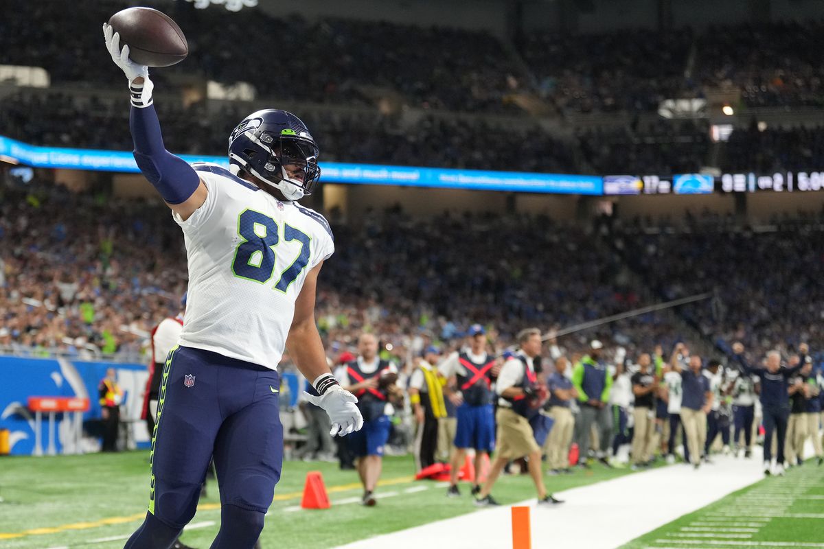 Noah Fant #87 of the Seattle Seahawks celebrates scoring a touchdown in the second quarter of the game against the Detroit Lions at Ford Field on October 02, 2022 in Detroit, Michigan.