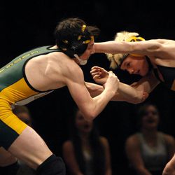 Students Brandon Meikel of Kearns and Trevor Cluff of Wasatch compete at the 4A state wrestling championships at UVU in Orem Thursday, Feb. 12, 2015.