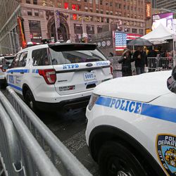 A line of police cars are parked along a street in Times Square, Thursday, Dec. 29, 2016, in New York. Police say they are up to the task of protecting the huge crowds that will gather in and around Times Square for New York City's massive New Year's Eve celebration. 