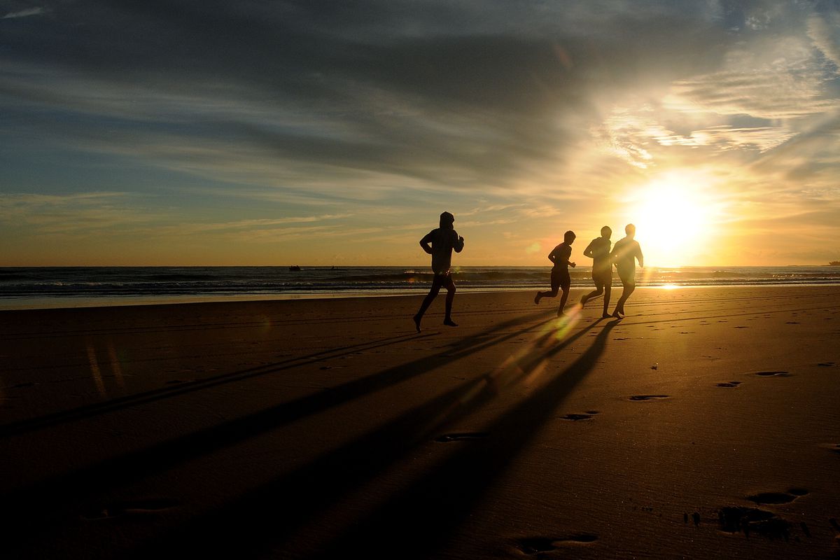 Competitors run on the beach prior to the start of day three of the 2013 Australian National Surf Lifesaving Titles on April 19, 2013 on the Gold Coast, Australia.
