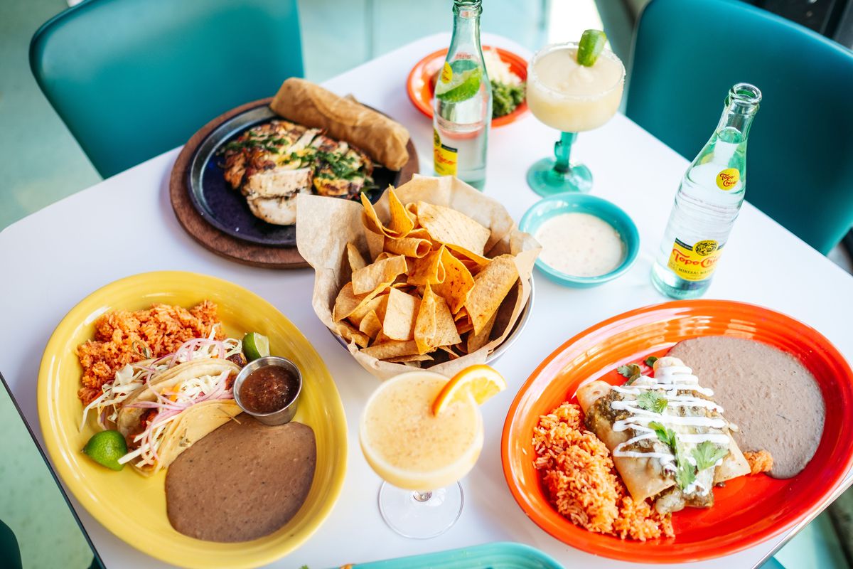 grilled fish tacos, tortilla chips, margarita, and flautas at Queso Beso 