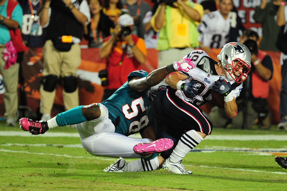 MIAMI - OCTOBER 4: Danny Woodhead #39 of the New England Patriots battles for a touchdown against Karlos Dansby #58 of the Miami Dolphins at Sun Life Field on October 4 2010 in Miami Florida. (Photo by Scott Cunningham/Getty Images)