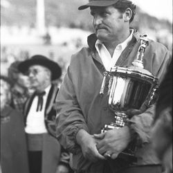 BYU head football coach LaVell Edwards receives the runner-up trophy in the Fiesta Bowl in December 1974.