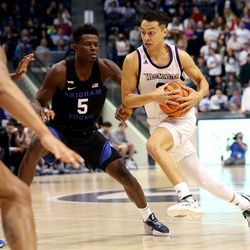 Brigham Young Cougars forward Gideon George (5) works to defend Westminster Griffins guard Taylor Miller (3) as BYU and Westminster play at the Marriott Center in Provo on Wednesday, Dec. 29, 2021.