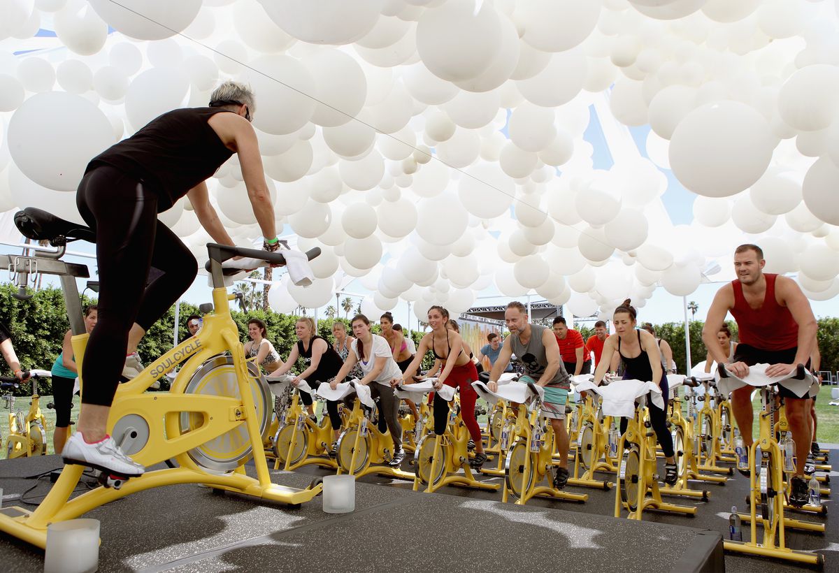 People on stationary bikes exercising as a class