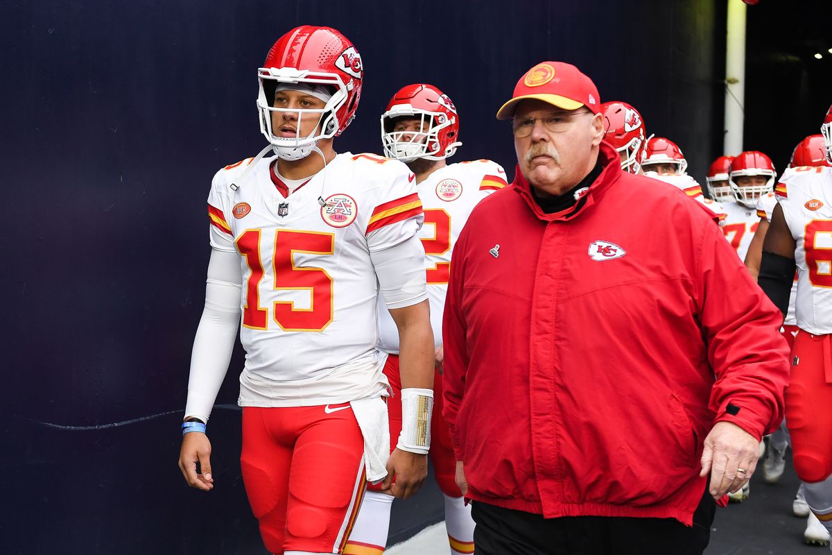 Patrick Mahomes #15 and Andy Reid of the Kansas City Chiefs walk onto the field prior to the start of the game against the New England Patriots at Gillette Stadium on December 17, 2023 in Foxboro, Massachusetts.